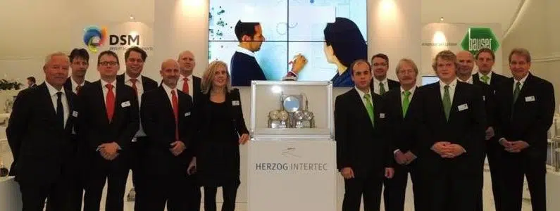Image international supplier fair 2012 several people in front of the HERZOG INTERTEC stand